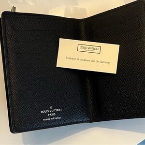 Louis Vuitton Black/Brown wallet slot of storage. Highly collectible piece